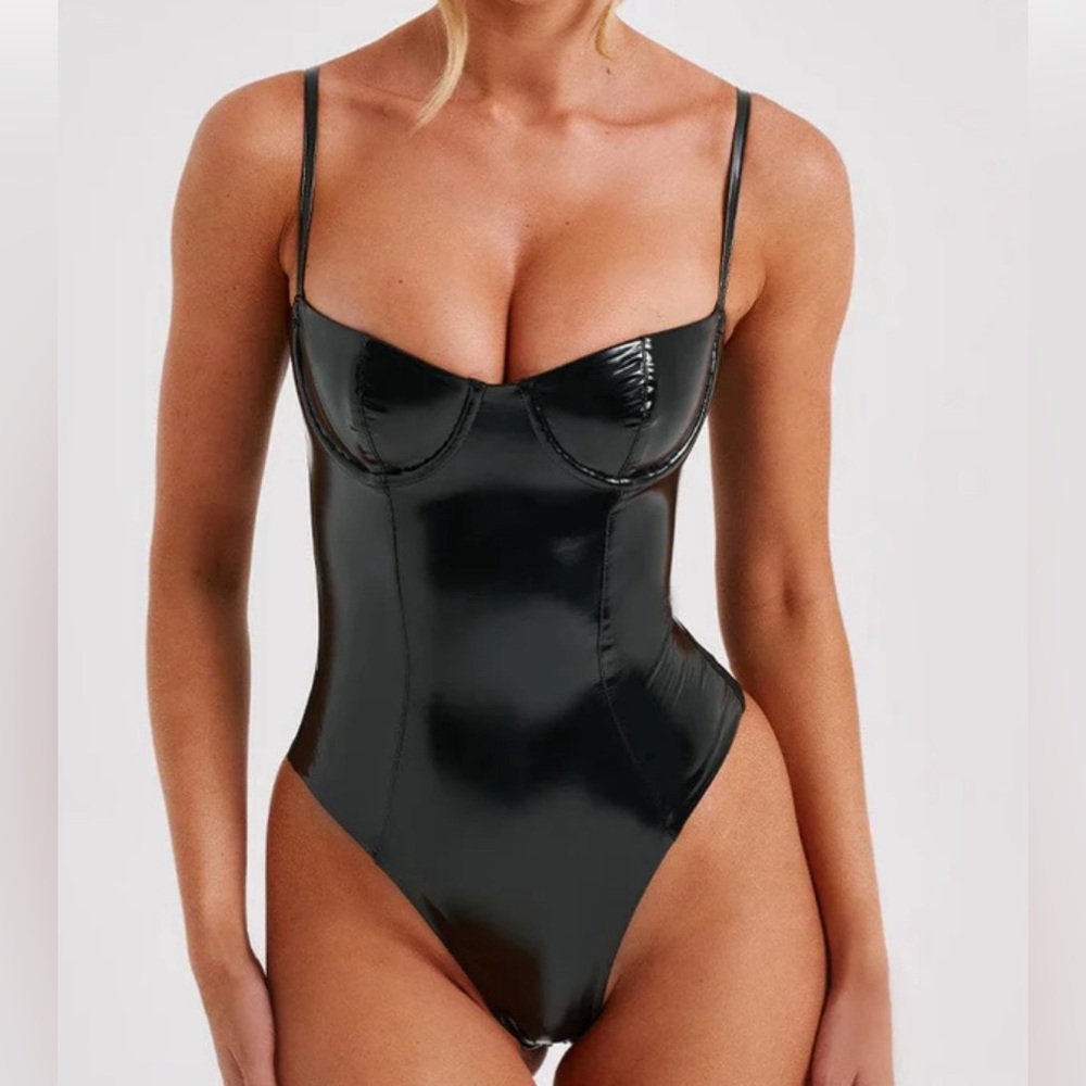 Brand New, Never Worn Black BabyBoo Vinyl with stretch body suit size Medium.
